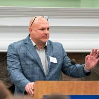 Male speaker at podium